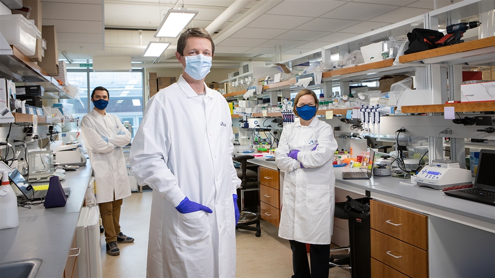 Nadia Rosenthal in her lab with a stylized frame running through the picture